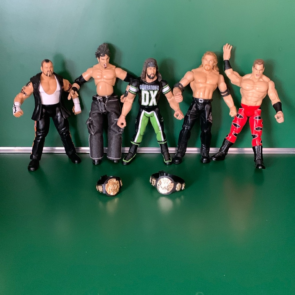 WWE action figures. Set of 5 with two WWE belts.